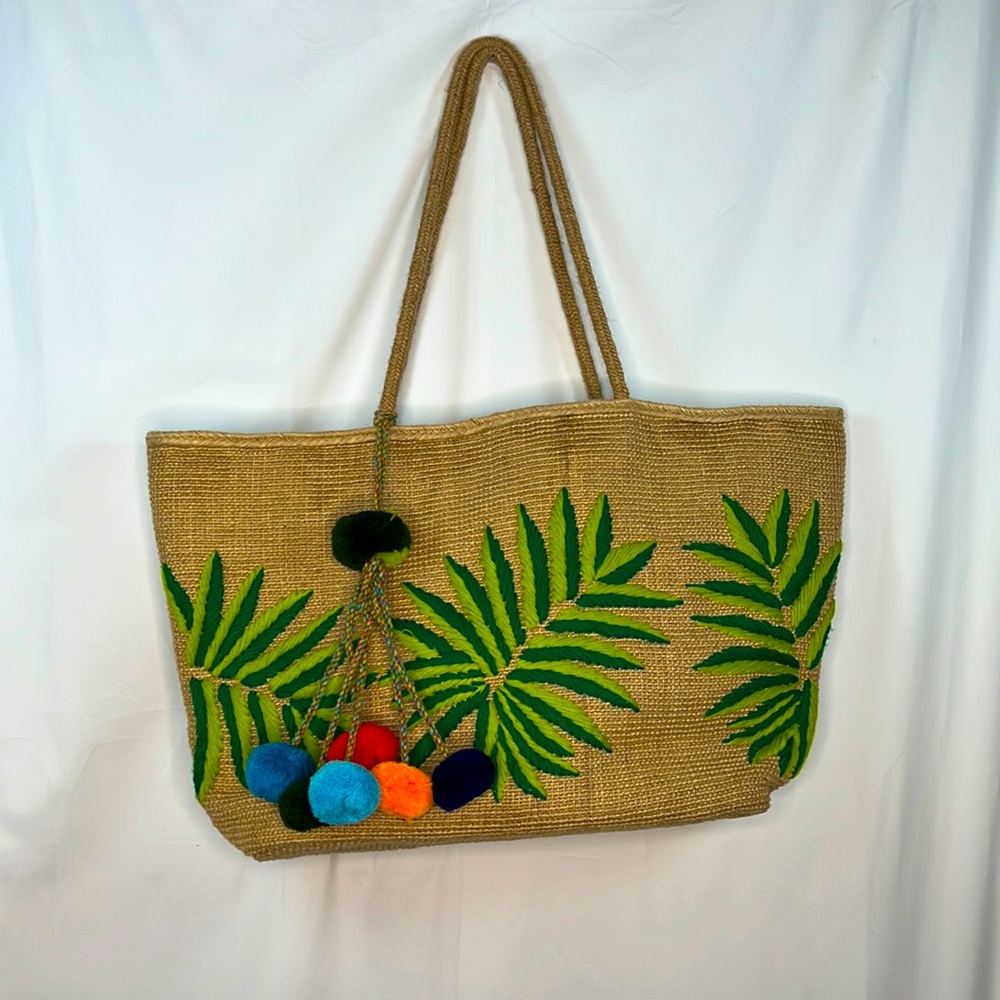 America and Beyond palm leaf jute tote with fun tassel